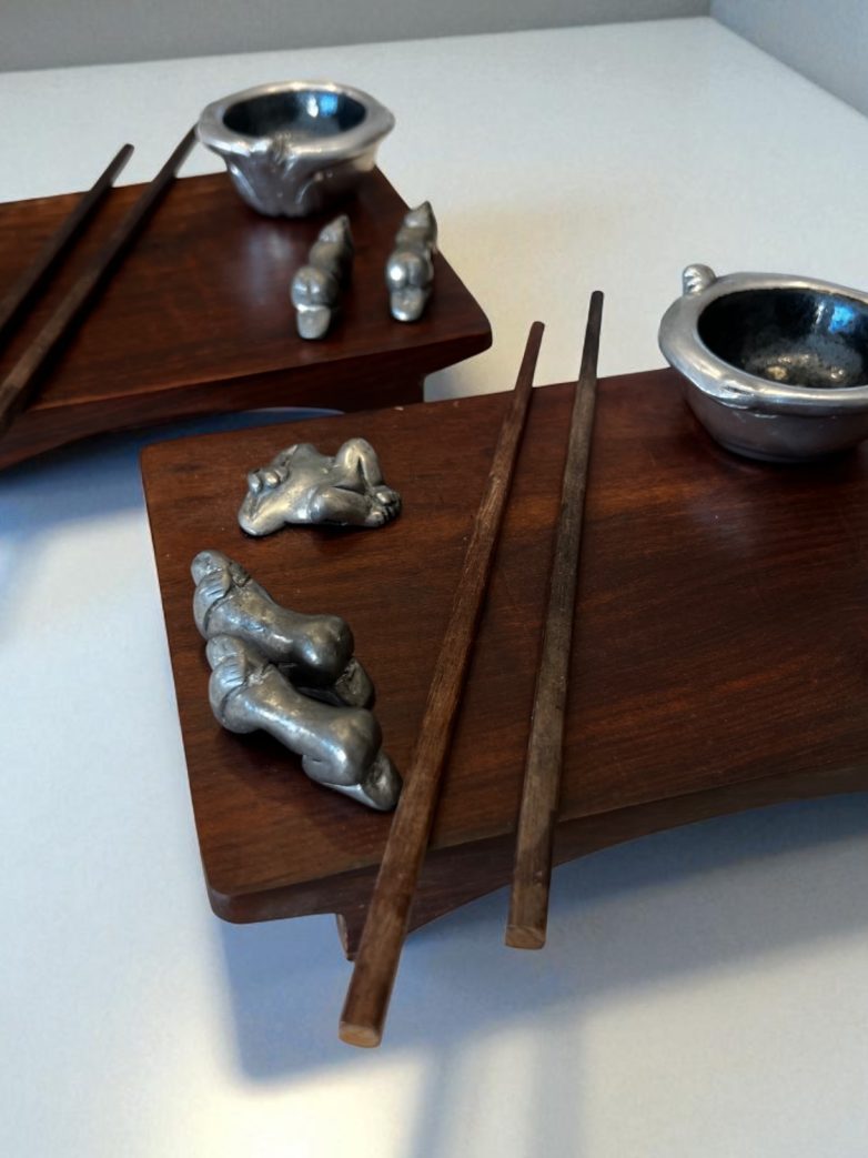 Full view of Carrol Boyes dining boards with accessories