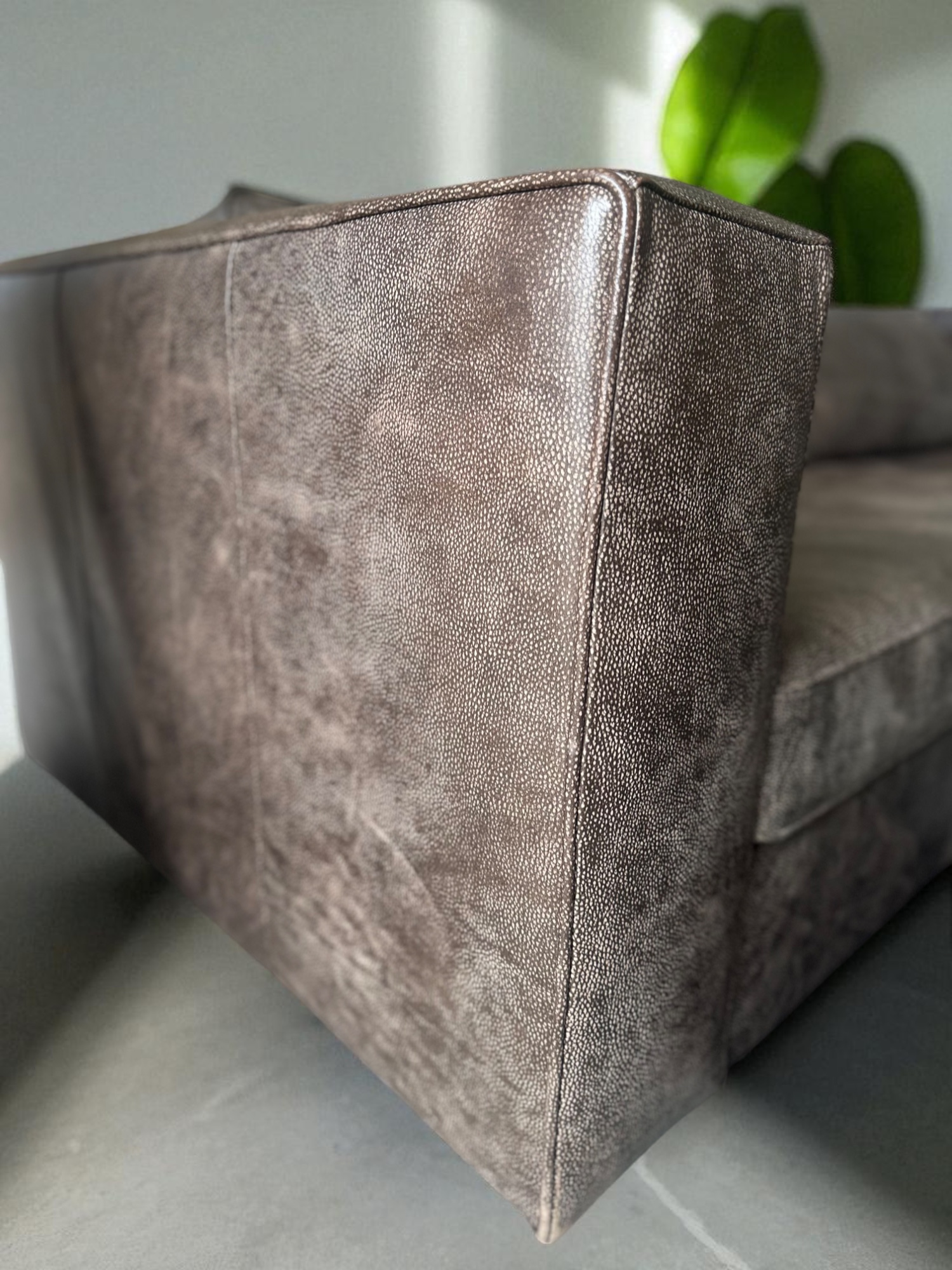 Side profile of Huxley genuine leather 3-seater sofa