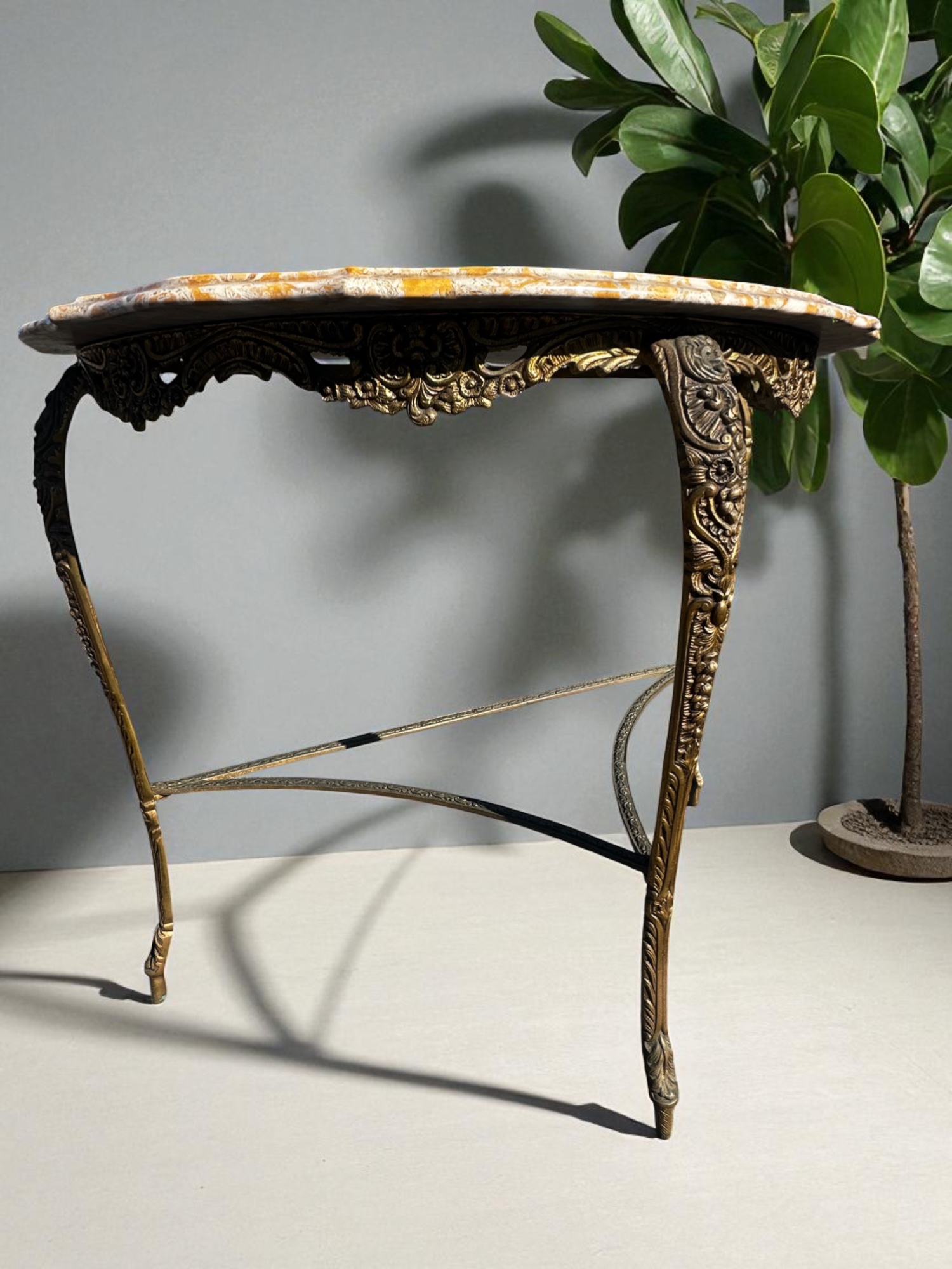 Side angle of vintage marble and brass console