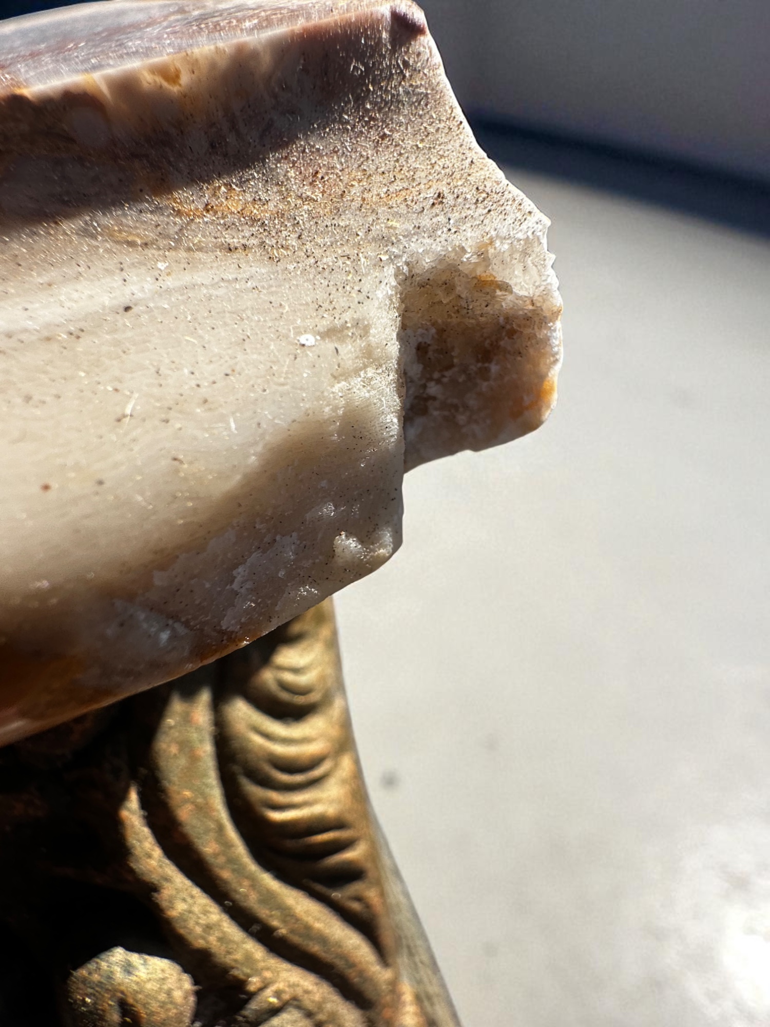 Marble top with visible chip on vintage console