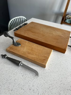 Set of Carrol Boyes sevring boards and a cheese knife